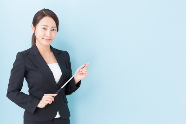 portrait of asian businesswoman on blue background