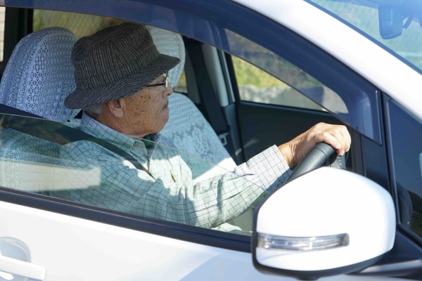 Senior person driving a car