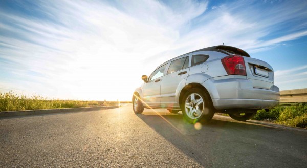 gray car on road over sunny day